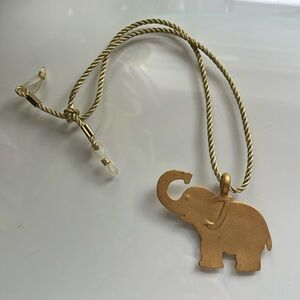 Gold elephant pendant on gold rope fabric chain necklace